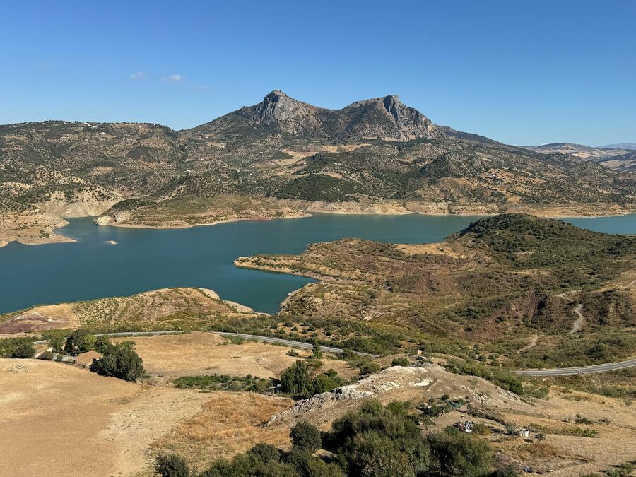 Zahara de la Sierra with Sierra de Grazalema mountains and turquoise lake