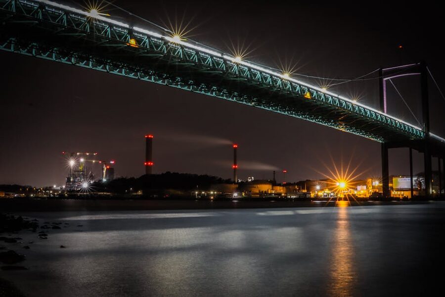 Alvsborg bridge in Gothenburg lit at night with reflections in the river