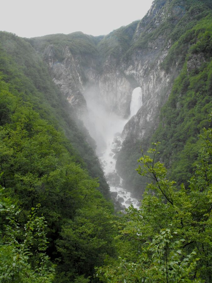 Boka waterfall plunging from a cliff in the Soca Valley