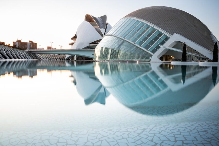 City of Arts and Sciences buildings reflected in shallow pool Valencia
