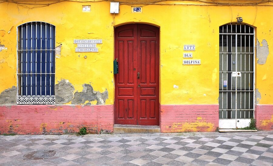 Narrow whitewashed street in Seville historic centre