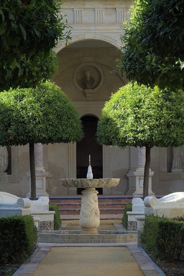 Casa de Pilatos small garden with stone columns and shaded paths