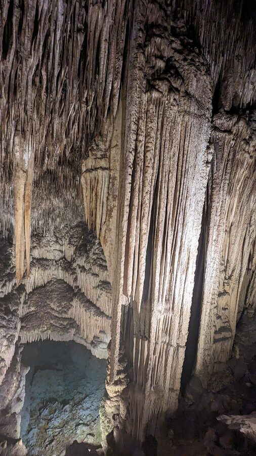 Cave passage at Caves of Drach Mallorca with stalactite ceiling