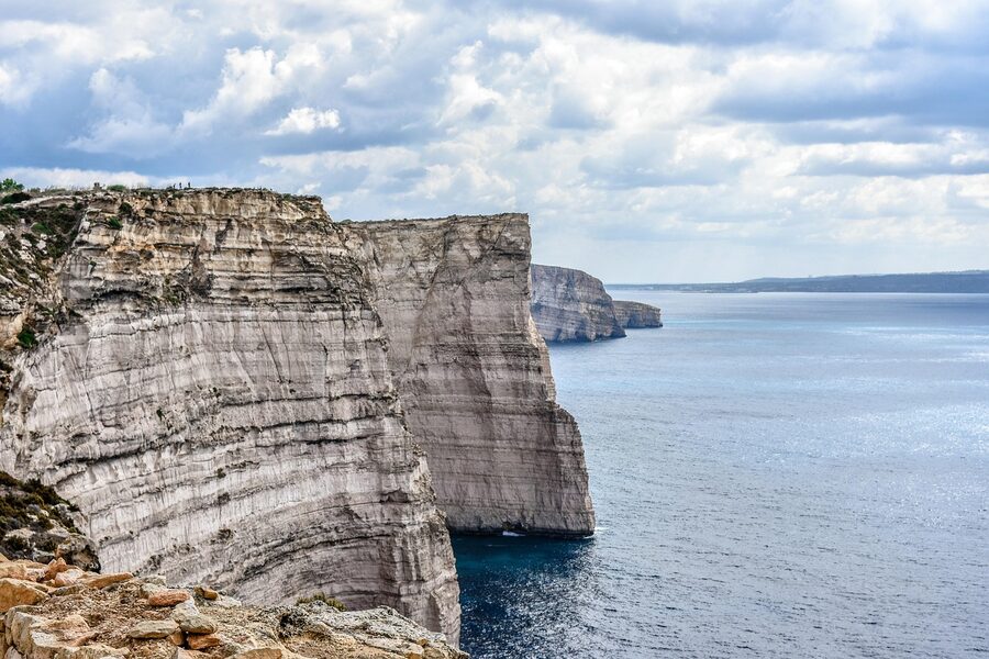 Limestone cliffs at Comino with deep blue Mediterranean water
