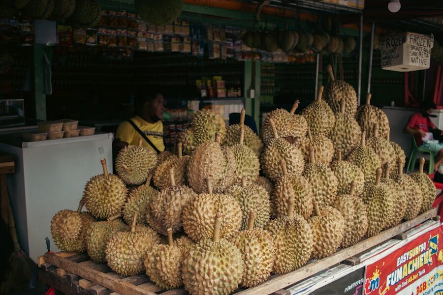 Durian market stall pile of fresh fruit