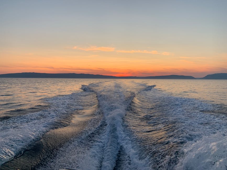 Sunset boat wake on a calm sea
