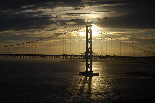 The Forth Bridge silhouetted at sunset over the Firth of Forth