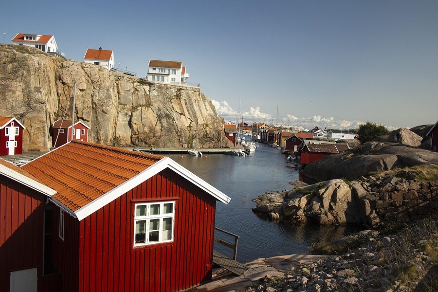 Wooden boathouses on rocky Bohuslan archipelago coast Sweden