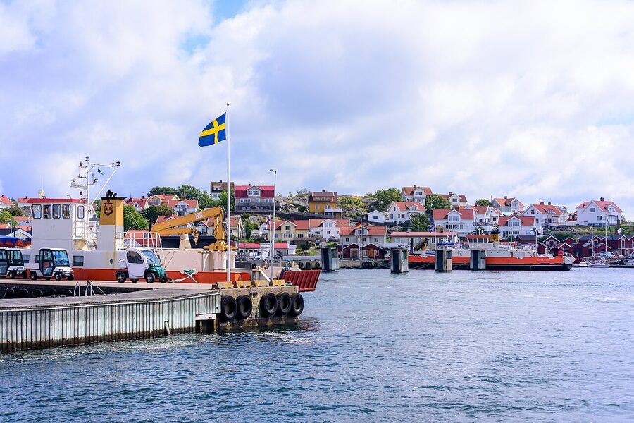 Donso island Gothenburg with classic red Swedish wooden houses on rocky shore