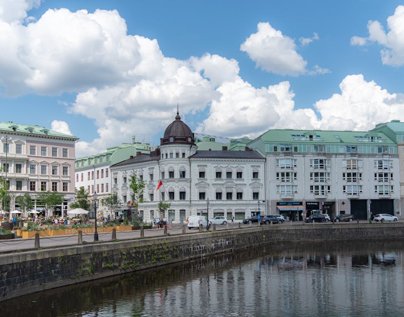 Historic Gothenburg waterfront with old building and modern ferry