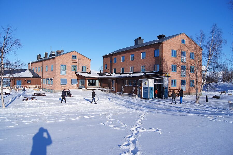 Abisko Turiststation main building in winter, snow piled high
