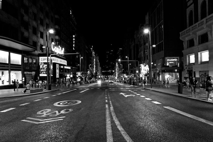 Gran Via Madrid evening street with neon and crowds