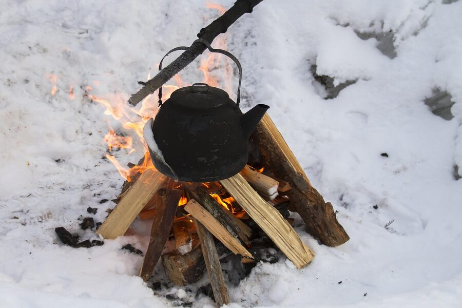 Campfire kettle for fika break on a husky tour in Lapland