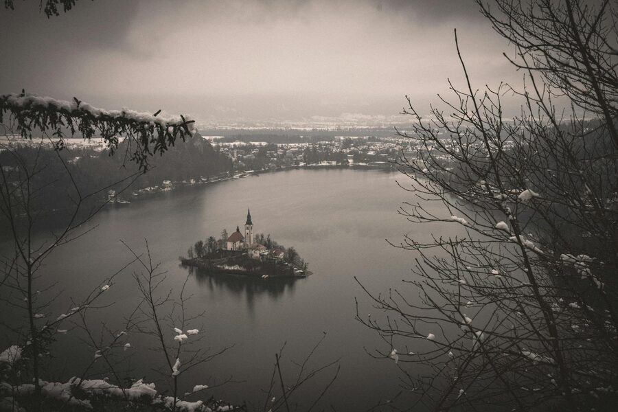 Bled Island in winter with the church under snow