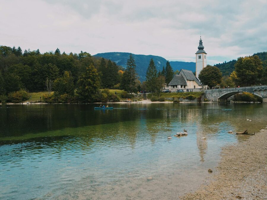 Lake Bohinj with the Church of St John the Baptist and mountains