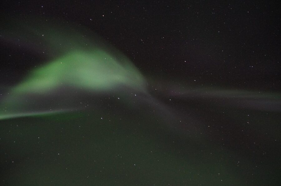 Bright green aurora borealis over Swedish Lapland snow