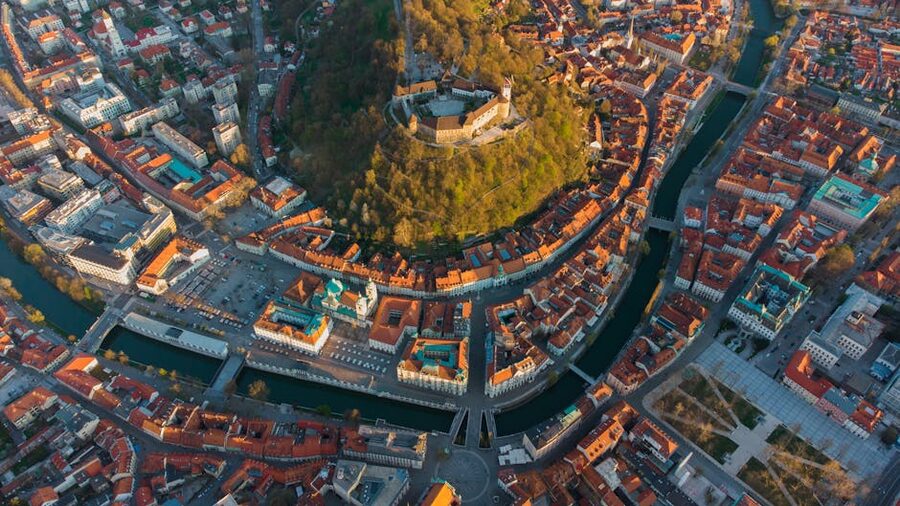 Aerial view of Ljubljana Castle with surrounding red rooftops