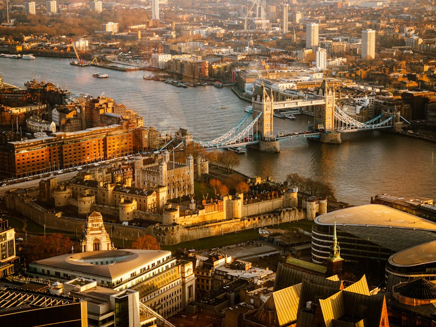 Aerial view of London at sunset showing Tower Bridge and the Thames
