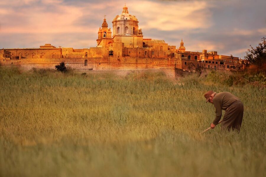 Mdina Cathedral viewed across central Malta countryside fields