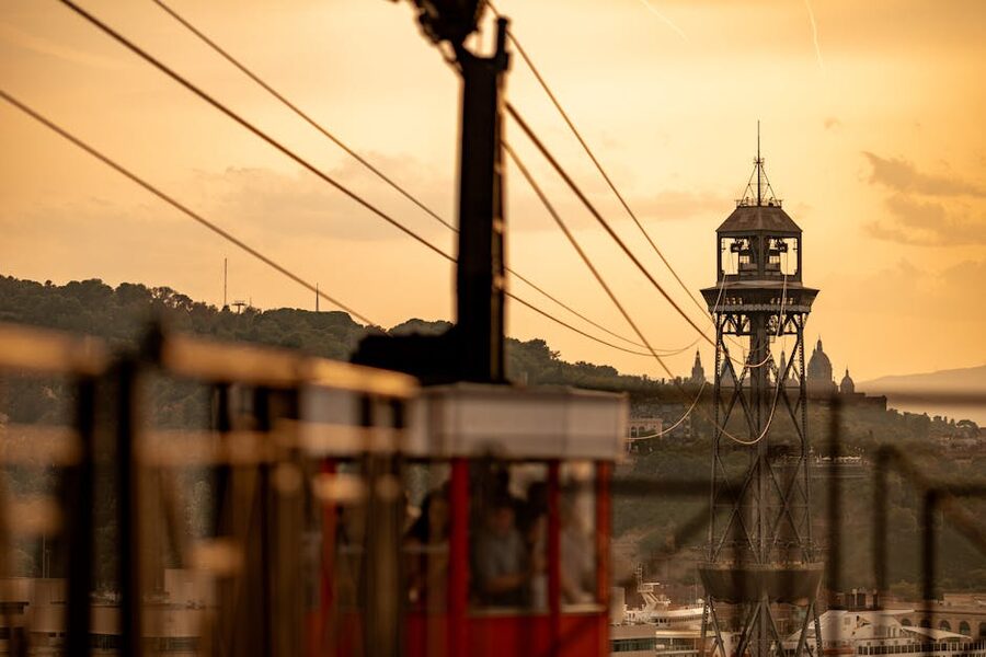 Montjuic cable car tower at sunset over Barcelona