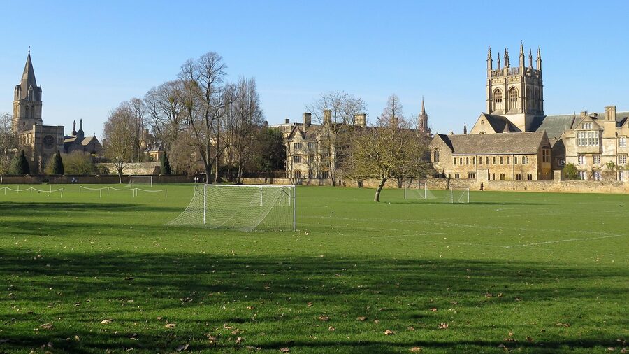 Christ Church College Oxford with meadow and historic spire