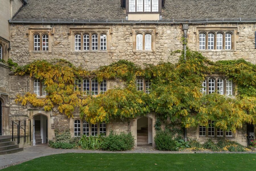 Oxford ivy covered stone facade with traditional architecture
