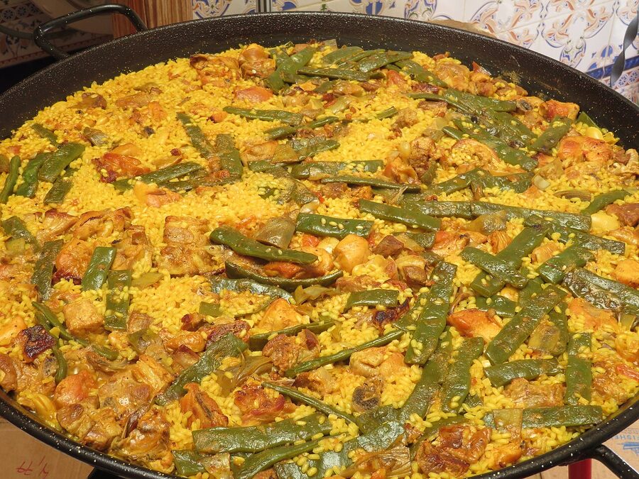 Forming the socarrat caramelised crust on a paella