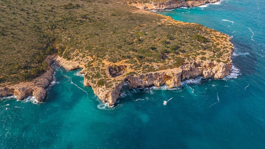 Jagged cliffs and turquoise waters on the Mallorca coast