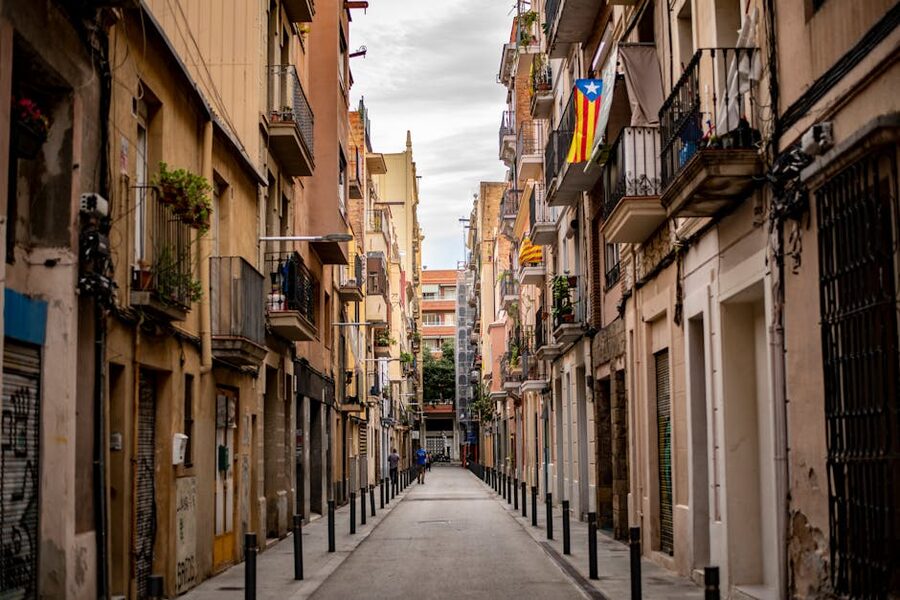 Narrow alley with balconies in Barcelona old town near Born