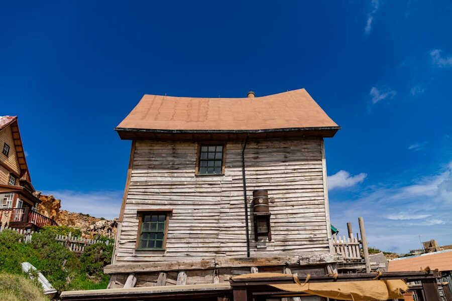 Popeye Village wooden house under blue skies