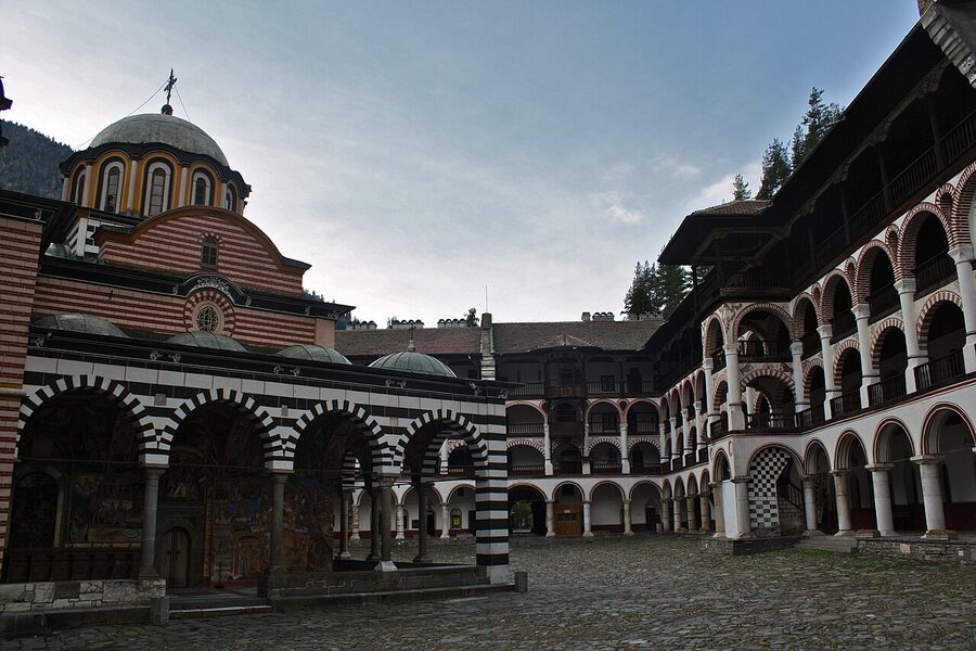 Inner courtyard view of Rila Monastery cells with painted ceilings