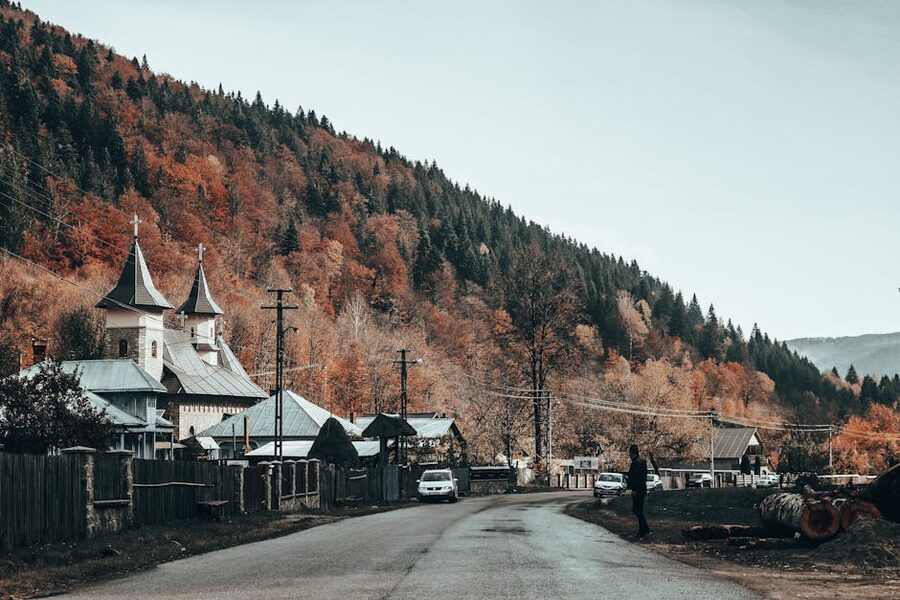 Romania village church autumn countryside near Brasov