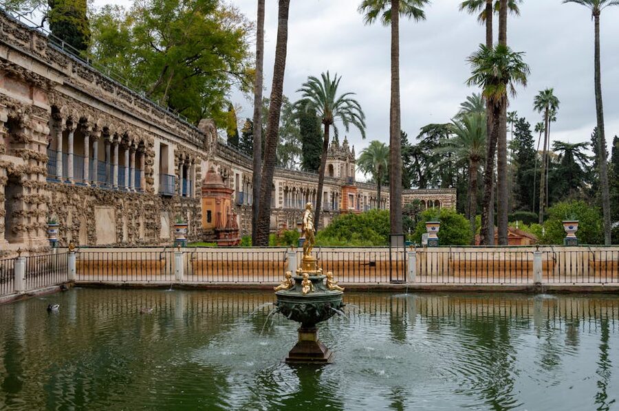 Royal Alcazar gardens with palms and water features