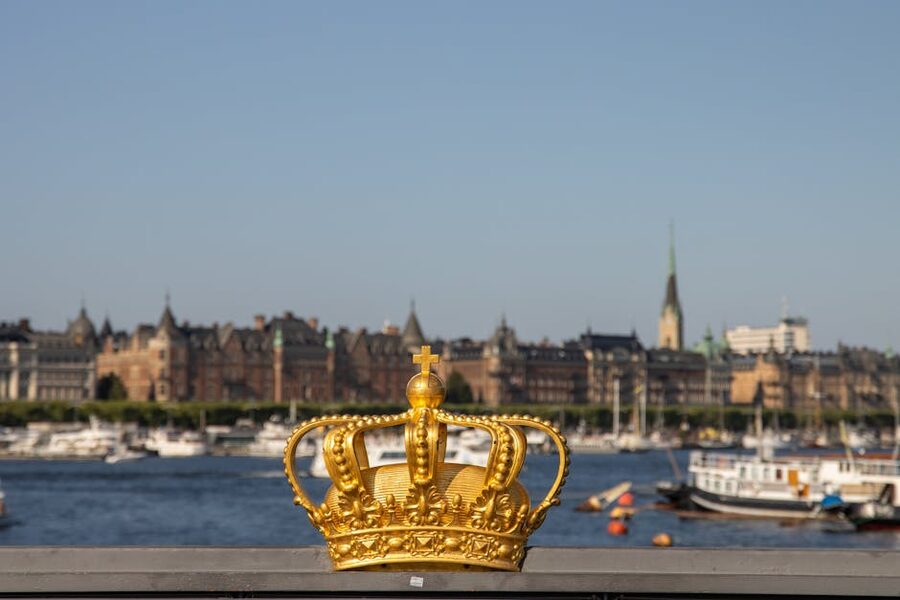 Golden crown decoration on Norrbro bridge near Royal Palace Stockholm