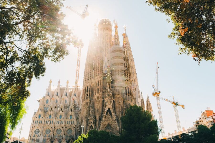 Sagrada Familia exterior with sunlight on the spires
