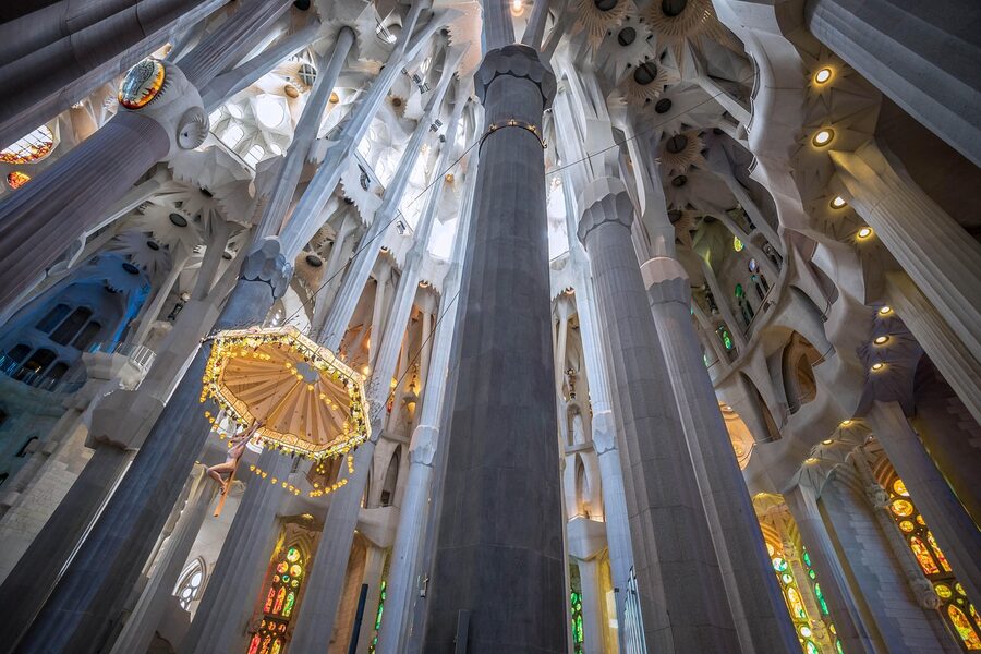 Sagrada Familia columns and crucifixion sculpture interior Barcelona