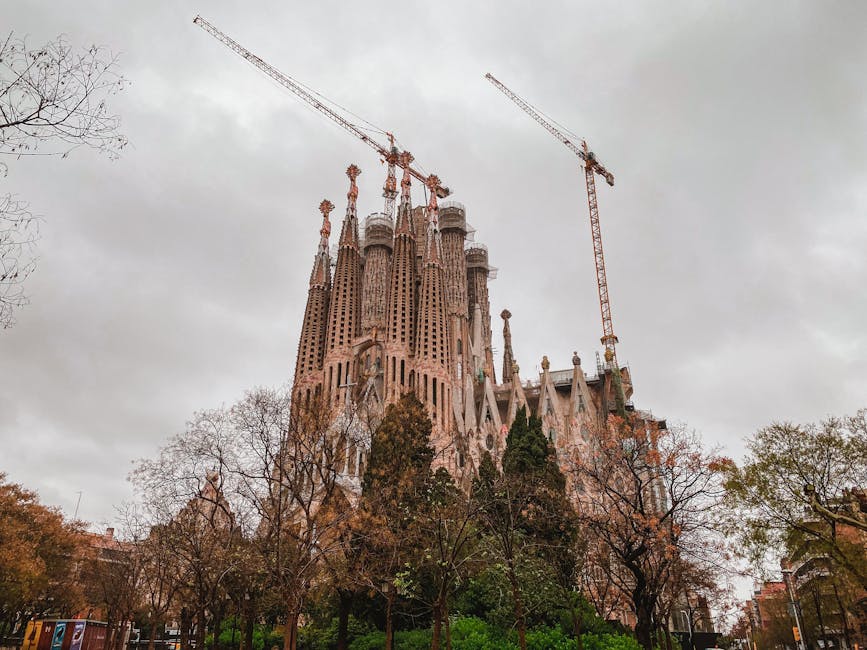 Sagrada Familia under construction with cranes Barcelona