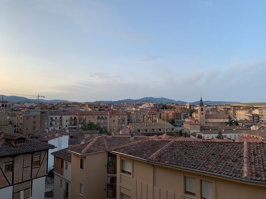 Segovia skyline at sunset with surrounding mountains