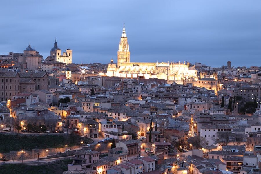 Toledo cathedral and old town illuminated at twilight