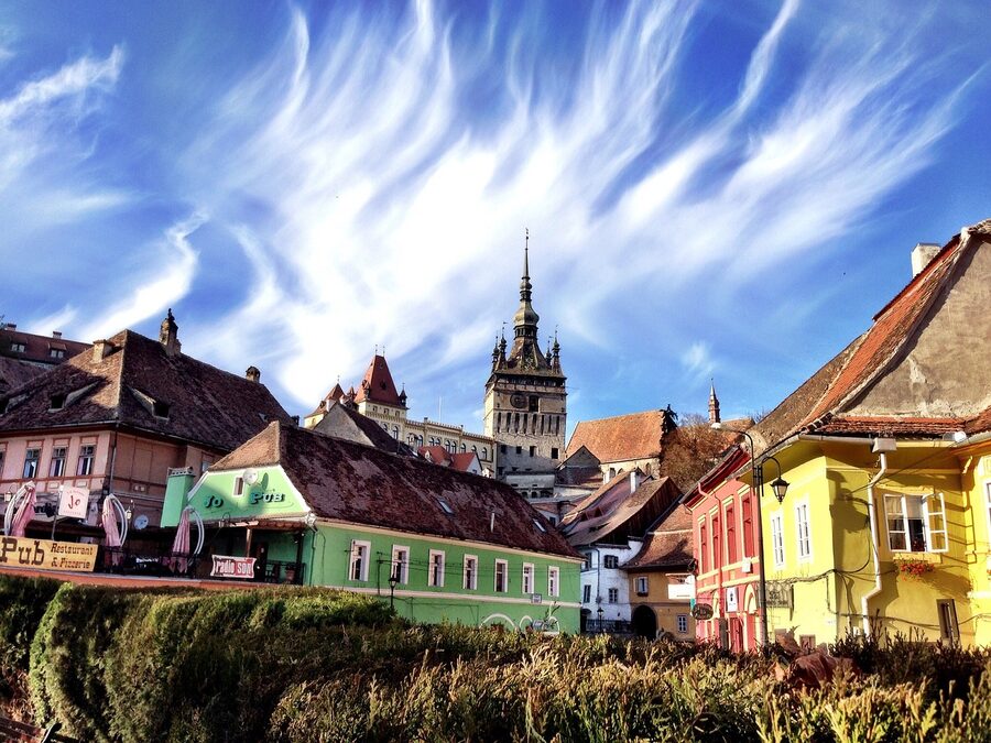 Sighisoara clock tower with adjacent square and historic buildings