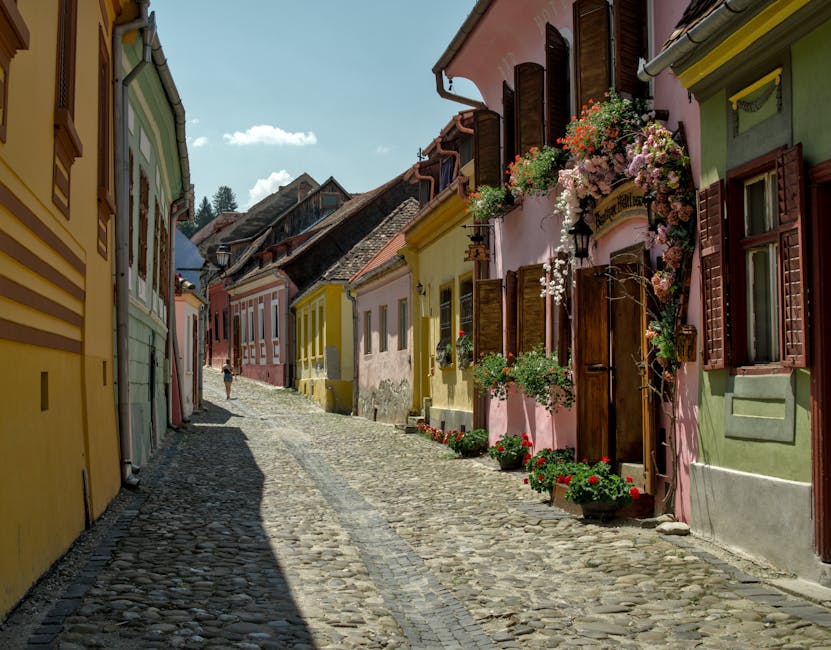 Sighisoara medieval old street with colourful houses and cobblestones