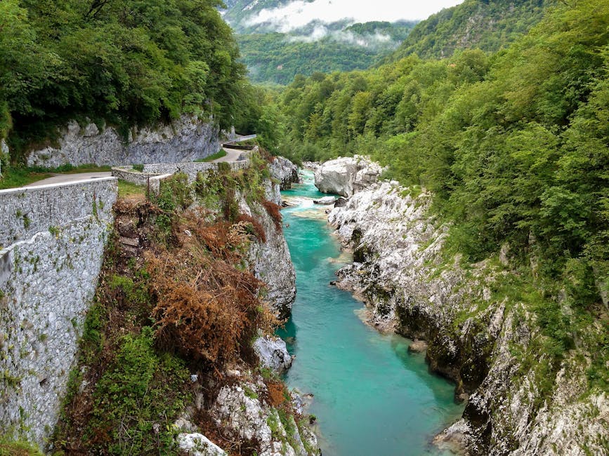 Soca River blue water flowing through a canyon between mountains