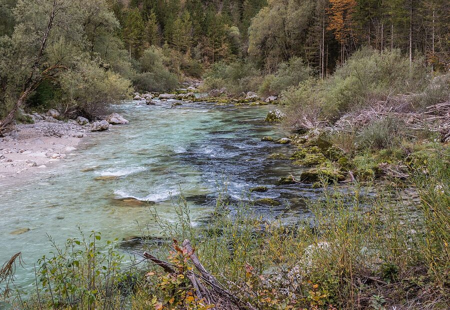 Soca River near Cezsoca with shallow turquoise water and rounded white pebbles
