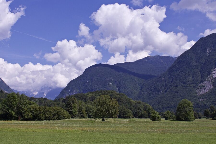 Soca Valley near Bovec with green meadows and mountains