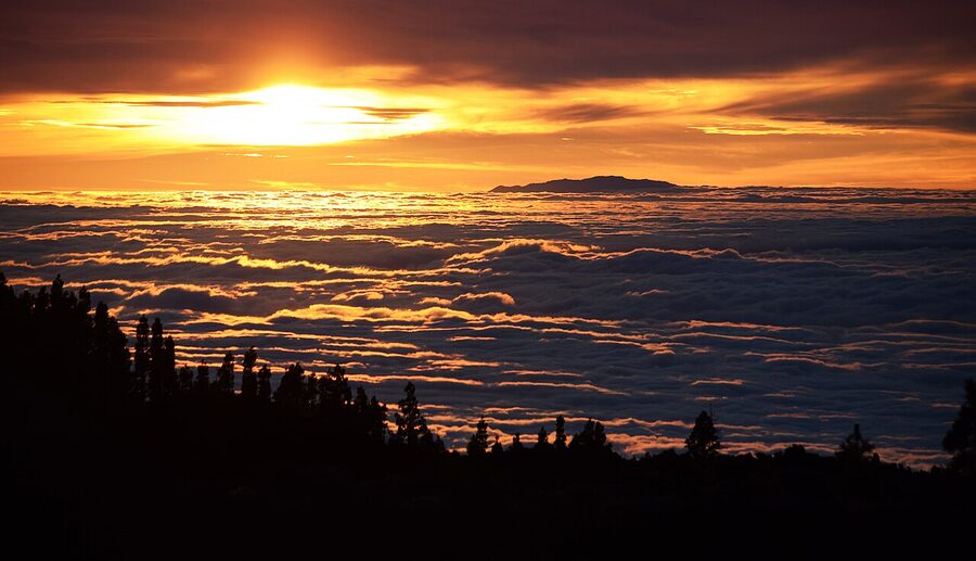 Pink sunset sky from Mount Teide, Tenerife, with the Atlantic and clouds below