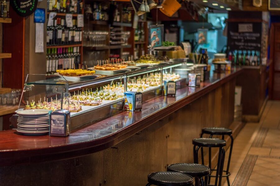 Tapas bar in Barcelona with pinchos lined up on the counter