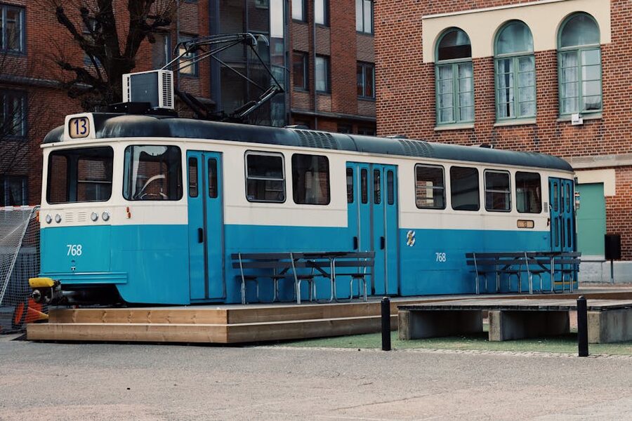 Blue Gothenburg tram arriving at a city stop