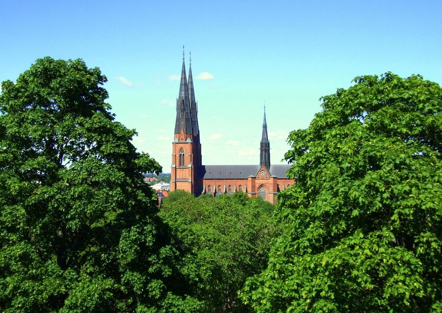 Uppsala Cathedral seen from trees in summer