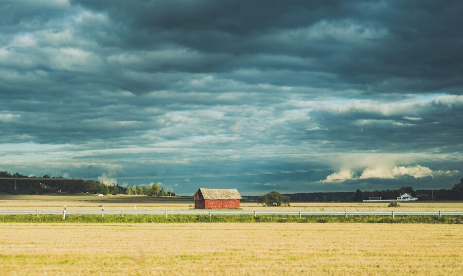 Uppsala countryside red barn under dramatic sky
