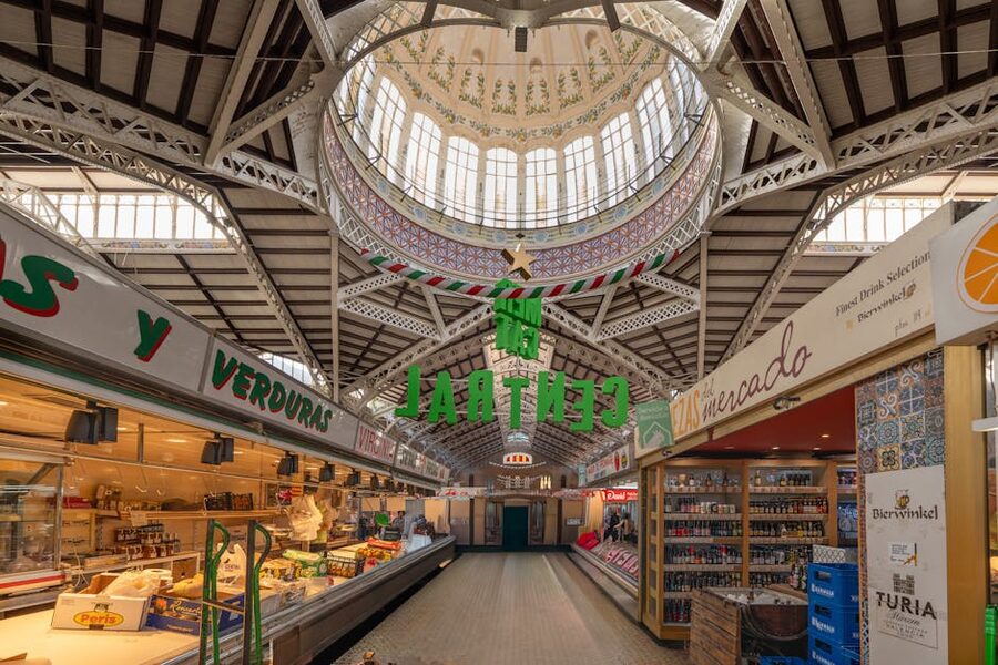 Valencia Mercado Central interior with food stalls and tile walls